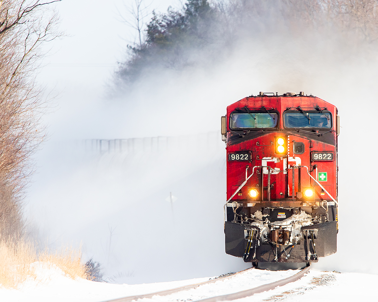 Canadian winter railroading in full swing as CP 9822 leads a late morning westbound into Trenton kicking up fresh snow along the way.