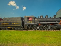 A beautiful looking NAR 73 steam engine sitting in the sun at the Alberta Railway Museum.