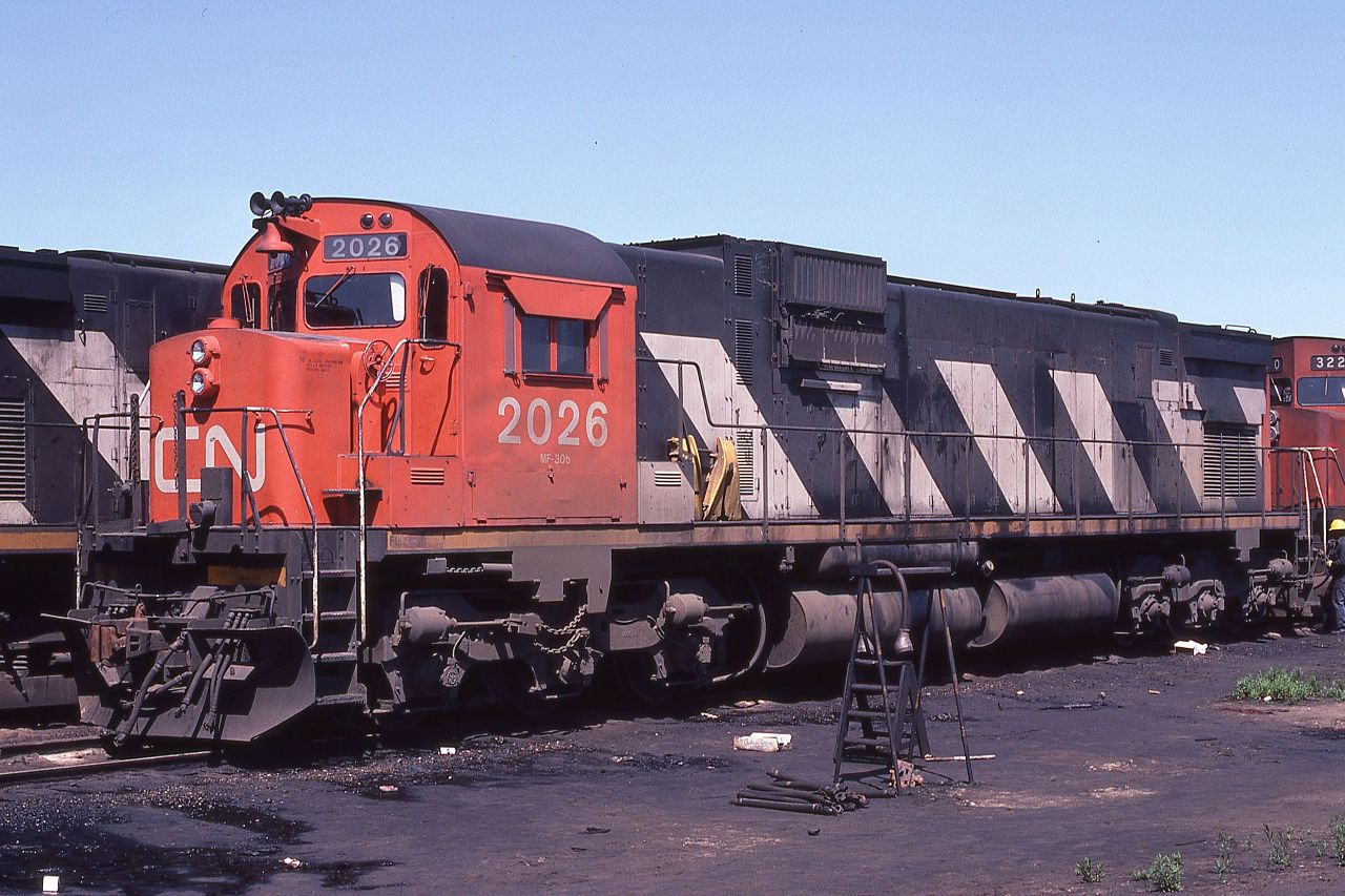 CN C630 2026 is shown on the inbound receiving track at MacMillan Yard, Toronto, Ontario on May 31, 1981.

HAPPY NEW YEAR EVERYONE.