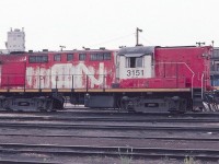 Canadian National MLW RS-18m is seen at the Via Diesel Terminal near Toronto Union Station in July of 1982. The unit looks a little worse for wear and was in need of a paint job.