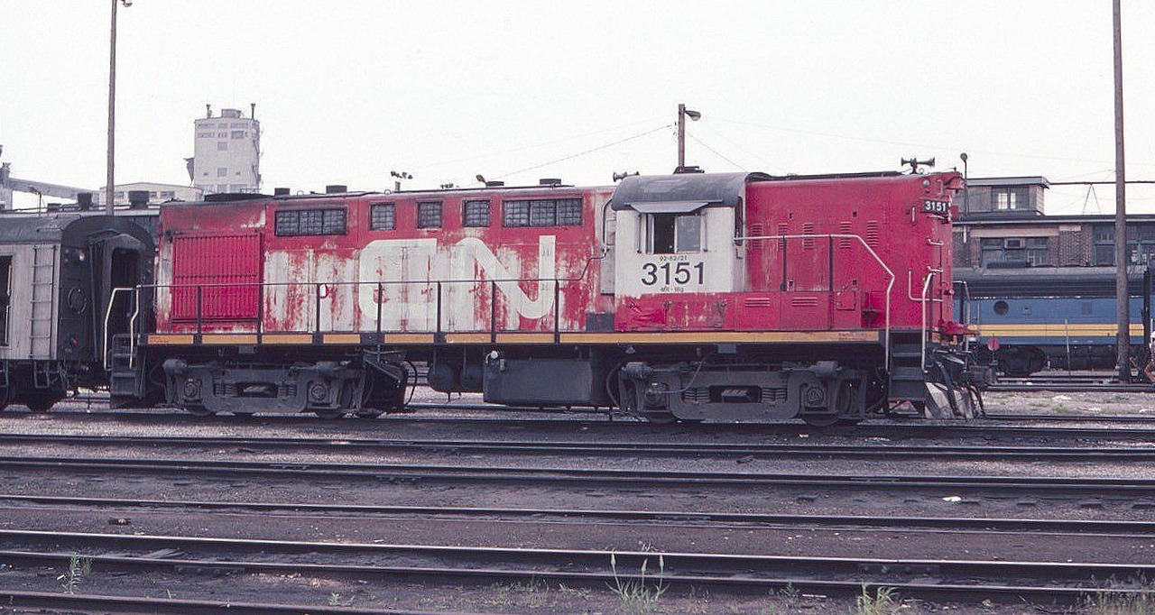 Canadian National MLW RS-18m is seen at the Via Diesel Terminal near Toronto Union Station in July of 1982. The unit looks a little worse for wear and was in need of a paint job.