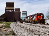 My reason for this picture was inspired by Ian Malenfant-Picard's recent posting of CN 4715 (05/11/2025, search photo 58127). With over 36.5 years between the 2 photos, although the 4715 still looks very much the same, there are a number of small differences. If you look back through my postings, I have taken a number of pictures at this location. But, none look like this. The track has been groomed to perfection. Trains were rolling by so very smoothly, even on the elevator track. As I have mentioned in my other captions, as great as this looked, by November of the same year, the grain elevators were torn down. By early 90's, no more speeders parked in the siding. Replaced by hi-rail trucks. GP38's by this time became the dominant power. In just 5 years (87/92), the face of railroading on this branchline went through quite a change.