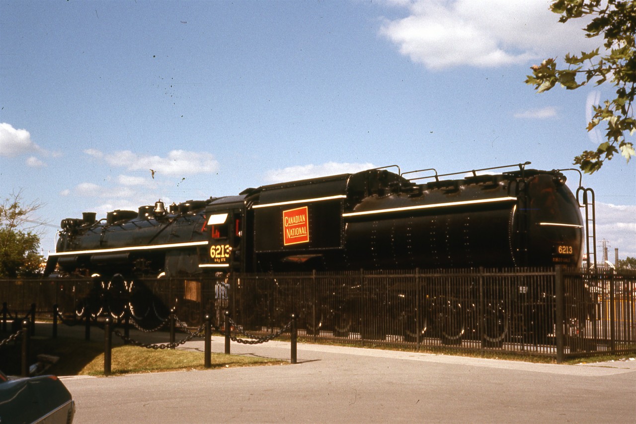 Before the move  
CN 6213 was built in 1942 at the Montreal Locomotive Works (MLW) Order No. Q394, Serial No. 69711. It was part of Canadian National Railway's (CNR) fleet of 200 U-2-g class "Confederations", later "Northerns". 
No.6213 was retired from active duty in 1959. At the request of the City of Toronto government, the locomotive was donated by CNR to the City of Toronto government in 1960 and put on static display at Exhibition Place. At the request of the Parks Department, it was placed beside the Stanley Barracks' Officers' Quarters, delivered there by temporary rail track. It was officially turned over to the Mayor of Toronto Nathan Phillips on September 8, 1960. 
Since 6213's retirement, the members of The Toronto Locomotive Preservation Society (TLPS), her primary caretaker, have faithfully worked to preserve the locomotive. It was moved to the John St. Roundhouse in 2009 at a cost of CA$150,000, paid for by Leon's Furniture, which had opened a store in the Roundhouse.