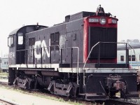 CN 8514 seen at the Toronto Union Station coach yards in August of 1983. Interesting bell, friction journal bearings and footboards on the MLW S-13.