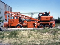 <b> Just a baby </b> <br>
Not even a year old. Still looking fresh and clean. <br>
CN RC 60752 (Automotive Services CN E075484) is a Holmes 60-ton capacity hi-rail wrecking crane, serial number xxxx, built in 1975. <br>
It is seen here at the Fort Erie, ON roundhouse in June 1976.
CN E075484 <br>
E Equipment Dept. <br>
0 Owned <br>
7 Truck <br>
5 1975 <br>
484 sequential vehicle number acquired in 1975
