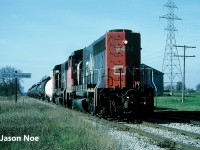 CN train 560 with GP40-2L(W)’s 9424 and 9508 are seen passing through Onondaga, Ontario as they head to Nanticoke on the CN Hagersville Subdivision from Brantford. This was the usual mid-90’s power for this assignment as it was typically powered by two or three GP40-2L(W)’s.