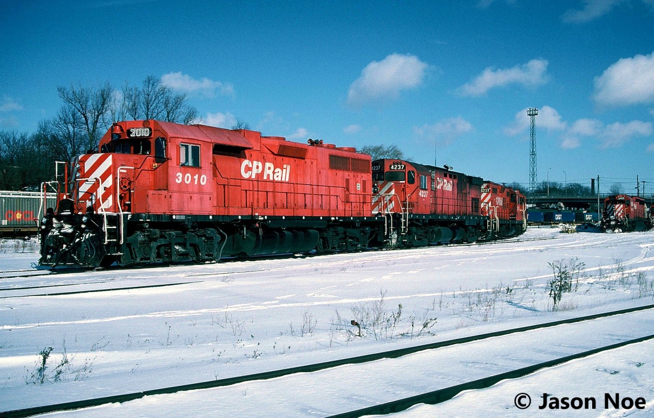 A frigid winter day sees CP GP38AC 3010 with a long string of motive power at Quebec Street yard in London, Ontario. The other units included; C-424 4237, GP9u’s 8237, 8205, 8208, 8211 and 8226. Also, on hand were SD40 5405 and SW1200RSu 1240. At the time, seeing a GP38AC on the London Division was quite rare as not many wandered down from Western Canada.