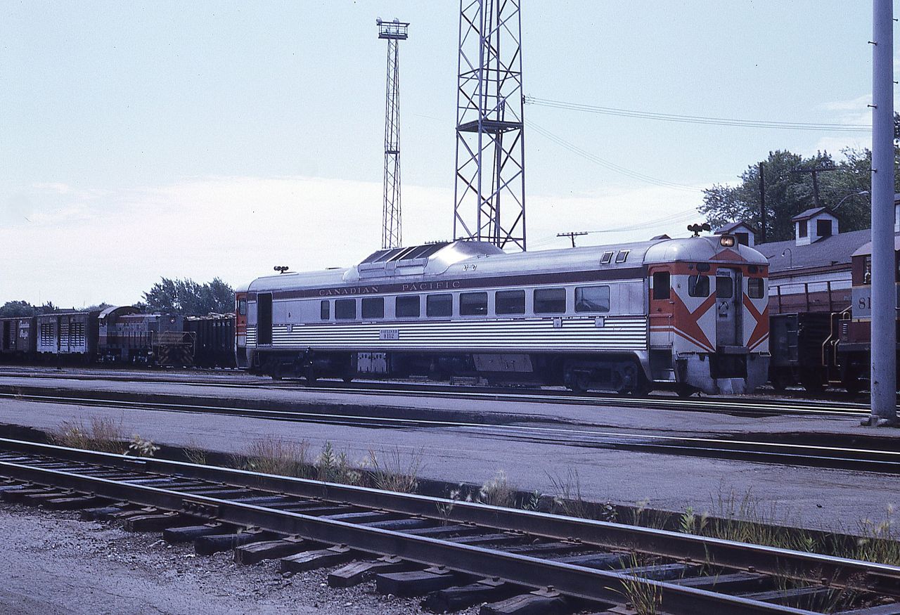 Canadian Pacific; Sudbury, Ontario; July 19, 1969.  There used to be a lot of interesting activity around many railway stations back in the 1960's.  Sudbury was no exception.  Budd car 9112 is working its way to the shop area having just arrived from Sault Ste. Marie.  S-2 switcher 7092 is blocked in by an SW1200RS in the 8100 series making up its train.