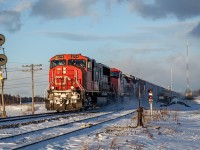 This is CN Manifest freight train 403 passing the old searchlight and dwarf signals at the eastern end of Saint-André siding on a very chilly late afternoon. On that day, temperature was down atleast 25 degrees below freezing point, but since trains aren't running daily on the Mont-Joli subdivision anymore, and now running on a rather unpredictable schedule, i figured i'd make up for it by taking on a little trip in order to catch both manifest freights in broad daylight, even if its freezing cold outside. Not only it was painfully cold for the face and the fingers, but the camera even had troubles when shooting, giving rather blury images even when properly focused. Luckily, i was able to salvage a couple of shots, including this one.
In the end, i didn't get frostbite, so that little trip was entirely worth it!