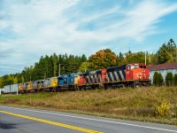 Train 561 led by GP40-2WL 9576 returns home to Mont-Joli with 4 engines from Sept-Iles and 3 cars, as it passes by the former site of the steam plant in Les Boules.
