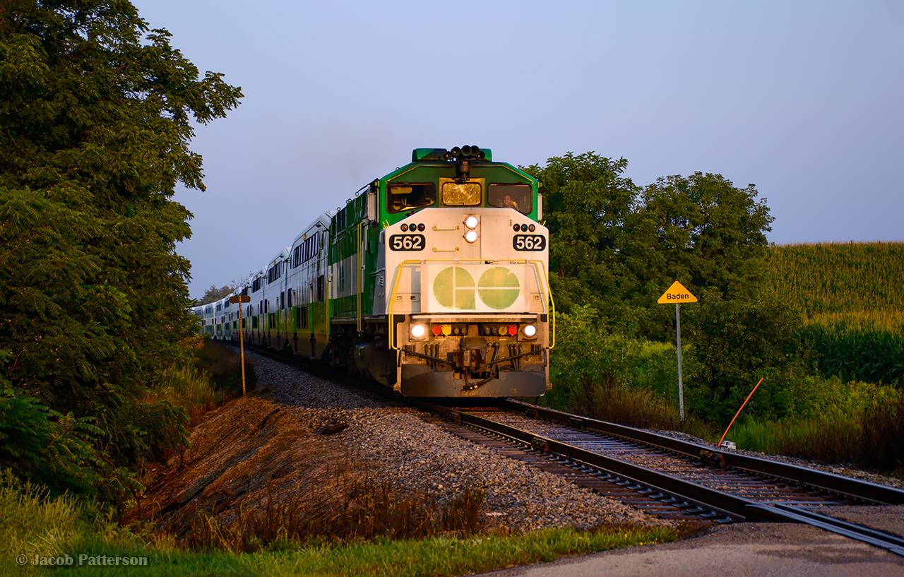 GO 3760 is Toronto-bound from London, passing the Baden mileboard on a hazy summer morning.