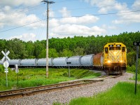 After two consecutive rainy days, it was nice to have a bit of sunlight for our last day on the RS. Here we see RS 66 lead the Laterrière turn at the last crossing before entering the plant. Here the train will switch for about half an hour before returning back to Port-Alfred.