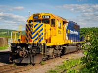 Leased to the Roberval & Saguenay railway for a couple of years, Ontario Northland SD40-2 #1735 works as the switcher for the port and yard of Port-Alfred, now part of the city of Saguenay. In this shot, the switcher had pulled aside to let the mainline train led by #63 enter the yard. Behind the SD40-2, you can see RS 65, which was one of the GP38-3s that ran the Laterrière and Grande-Baie trains that day. Roberval & Saguenay recently recieved an SD40u from CN, this engine might spell the end for 1735's time on the roster.