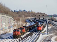 CN 527 (at left) is passing a stopped CN 713 at Turcot Ouest on the last day of 2025.