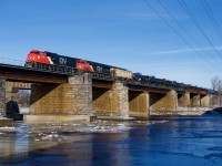 My last train shot of 2025 as empty ethanol train CN 713 crosses the partly frozen Ottawa River near Île-Perrot with CN 8352 & CN 2873 for power.
