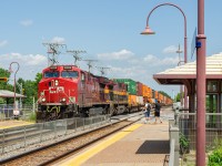 Canadian Pacific train 133 begins its trip to Chicago, as it passes by the Beaurepaire AMT/EXO commuter train station. I originally intended to catch this train further down the line, but due to the lack of traffic that the CP line sees in the morning, i decided to head up somewhere i could also catch CN's trains. In the picture you can see two fellow railfans, the spot became quite popular during the afternoon, as many went to Beaurepaire to catch a CN train headed by CP and CPKC power, a rare occurence apparently. If you wish, you can see a picture of this train on my profile.