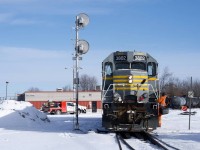 CN 591 heads towards the shop track and prepares to tie down at the end of its shift at Coteau. A crewmember has his grip ready as he rides IANR 3802.