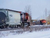 CN 368 and CN 271 are about to pass each other at Sainte-Anne-de-Bellevue, where CN once had a station at right.