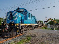 Gaspé Railway's short crushed stone train getting unloaded at Maria. In late spring 2025, Beluga Construction contracted the Gaspé Railway in order to transport crushed stones for a beach replenishment project in Maria. From July to December 2025, up to 6 train trips a day carried the stones from a quarry east of Nouvelle to a transload facility on the Route des Hirondelles, in Maria. The stones were then transported by trucks for the short distance remaining to the beach. These operations allowed to lower the vehicular traffic on Route 132 during the summer months, the highway being already saturated with traffic.
