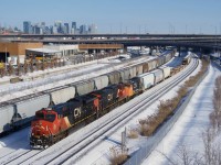 CN 527 is passing a parked potash train (CN B730) as it heads towards Taschereau Yard. Power is CN 3180, CN 2846 & CN 4765. CN B730 always parks here for a few hours to refuel and sometimes for a longer period if the train is staging.