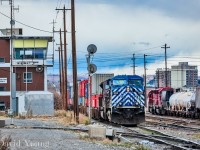 An eastbound hotshot led by a pair of CEFX leasors arrives at Aylth yard passing the old 12th Street Tower while the hump utilizing SD40M-2's CP 5494- CP 5496. The tower played an integral part, controlling movements at the western entrance to Aylth yard, located south of the Brooks Sub mainline near the east leg of the wye for the McLeod Sub. It would not survive the Hunter cuts following the hostile takeover in by Perishing Square in September 2011. The tower like a number across the system were removed and the RTC jobs moved to an existing desk at the NMC in downtown Calgary. I'm not sure of the date of closure or removal however comparing Google streetview images it was gone by June 2014.