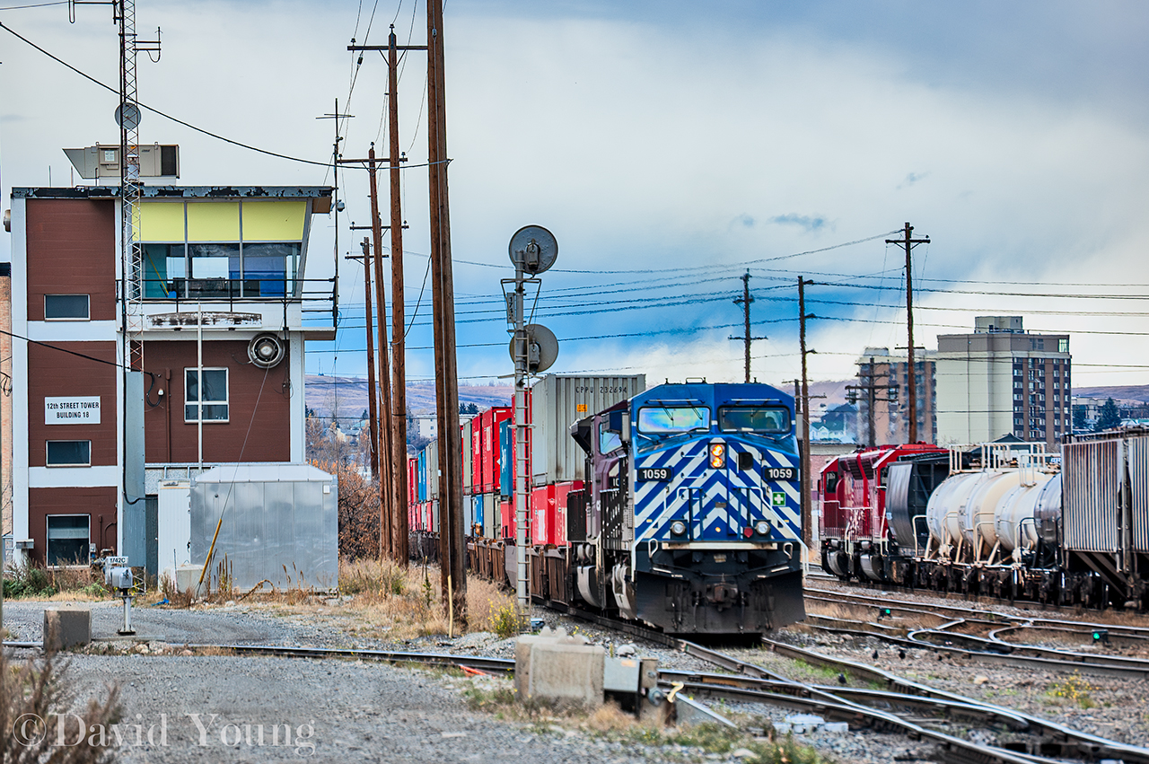 An eastbound hotshot led by a pair of CEFX leasors arrives at Aylth yard passing the old 12th Street Tower while the hump utilizing SD40M-2's CP 5494- CP 5496. The tower played an integral part, controlling movements at the western entrance to Aylth yard, located south of the Brooks Sub mainline near the east leg of the wye for the McLeod Sub. It would not survive the Hunter cuts following the hostile takeover in by Perishing Square in September 2011. The tower like a number across the system were removed and the RTC jobs moved to an existing desk at the NMC in downtown Calgary. I'm not sure of the date of closure or removal however comparing Google streetview images it was gone by June 2014.