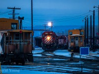 Power from the grain pool mingle amonst the equipment that make up the Thunder Bay auxillary near Thunder Bay's East End, one March evening.