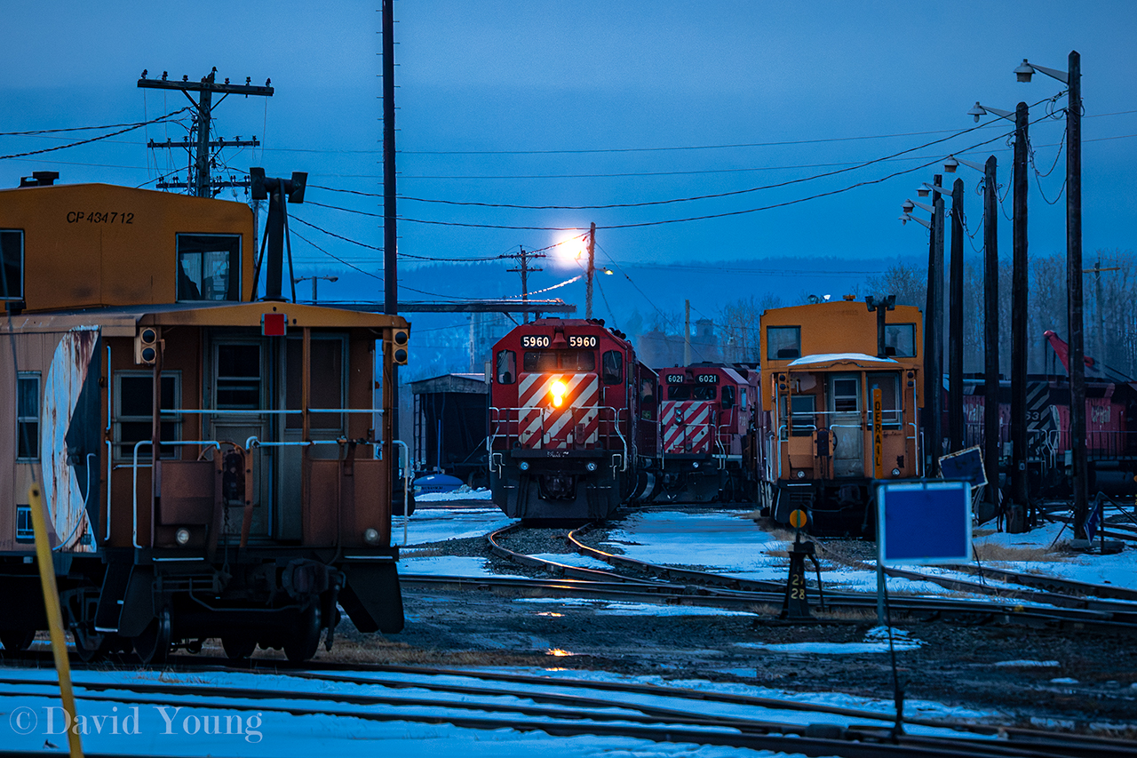 Power from the grain pool mingle amonst the equipment that make up the Thunder Bay auxillary near Thunder Bay's East End, one March evening.