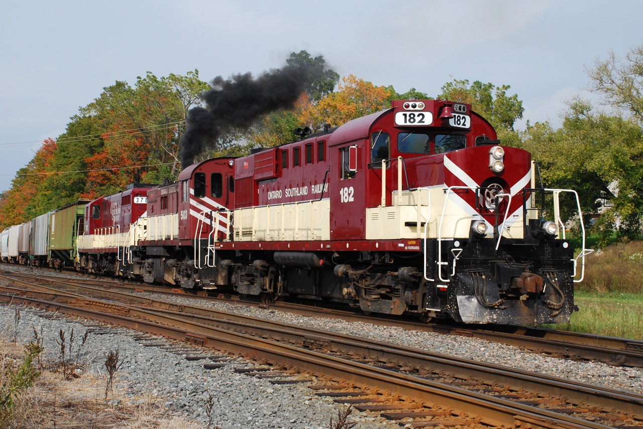 OSR 503 lets out a belch of black smoke as the Woodstock Job pulls off the CP Galt Sub. and in to the small yard in front of the CP Woodstock station (behind me).