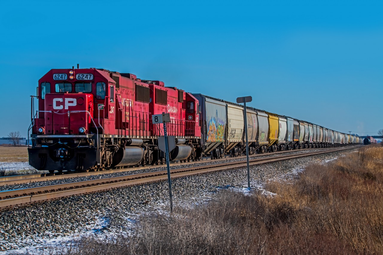 Dragging a long line of hoppers West out of Winnipeg.