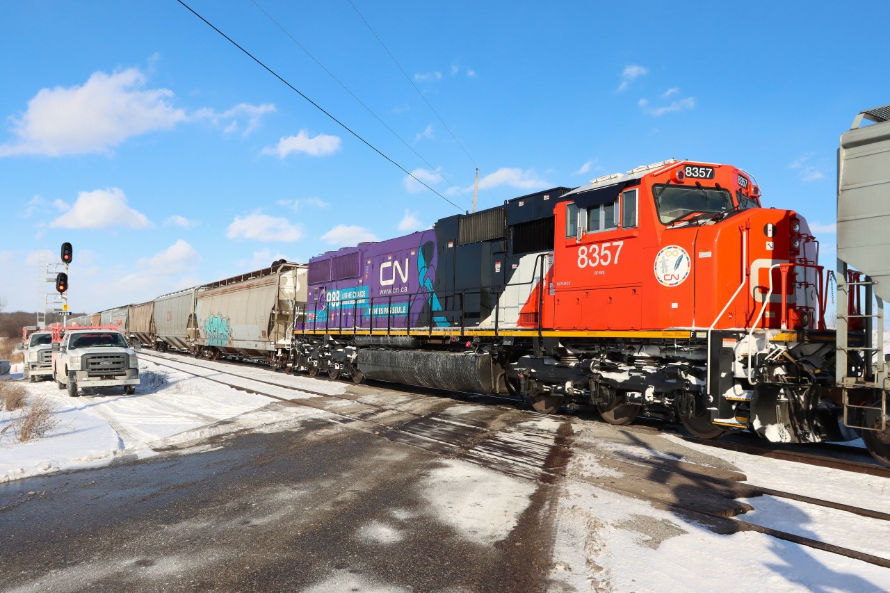 Carrying the message "YOU ARE NOT ALONE-TU N'ES PAS SEULE" in support of Mental Health Awareness, recently rebuilt SD75IACC CN 8357 performs mid-train duties on G874 heading toward Ash for a meet with two westbound Intermodal trains.