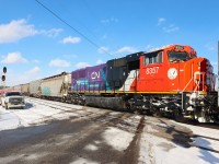 Carrying the message "YOU ARE NOT ALONE-TU N'ES PAS SEULE" in support of Mental Health Awareness, recently rebuilt SD75IACC CN 8357 performs mid-train duties on G874 heading toward Ash for a meet with two westbound Intermodal trains.