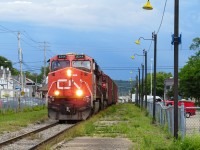 This is train 559 Eastbound going through Rimouski station on a Sunday afternoon. Back until about a year ago, the regular 402/403 ran as a 559 on Sundays only between Mont-Joli and Rivière-du-Loup in order to feed the newsprint mill with some fresh woodchips and sometimes empty boxcars. Since the mill's closure in early 2025, the Sunday 559 run was replaced by the 559 run that used to run on Saturday evenings, which is made up of the usual 2 geeps servicing April Lubricants in L'Isle-Verte, JM Bastille and the transload facility in Rivière-du-Loup and sometimes the Coop in Le Bic. They depart Mont-Joli with cars dropped from train 402 in the morning, and unlike the old run, returns light to Mont-Joli in the afternoon, as they leave the westward bound freight cars in RDL for 403 to pick up the next morning. In this picture, we can see that the train brings back a few empty woodchip gondolas from the mill, as they are heading to Fornebu lumber in Bathurst for reloading. Another thing that have changed since this picture was taken is the platform. The following year, the city's public works torn up the old asphalt platform and laid down a new one made of gravel, they also replaced the old light fixtures that weren't working anymore with brand new LED ones, keeping them in the same style as the old ones, although now painted in black. Not all changes are for the worst i guess!