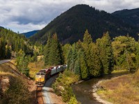 A taste of home in a far away land...

After spending 4 days marveling at the efficiency of CP RTC and trains in the Kootenay Valley (especially the Windermere sub), CP had to give us a reality check and a reminder that they are still incompetent, even in BC. The reminder this day was CP 416, which was tasked to work a small block-swapping yard along the Cranbrook sub called Tochty. They arrived at Tochty around 07h00 local time and by 10h00, when 7016W 419 arrived, they were still working the yard. So 419 waited. And waited. And waited. Eventually, CP realized 416 wasn't going to make it to Fort Steele in their 10, so they pulled a crew off a waiting grain empty and gave them 416. Finally just after 1pm, 416 finished the last of their yard work and shoved down the main to clear up the yard for 419 to pull in. Once 419 had the yard to themselves, it was a quick 5 car set off (no more than 30 minutes) and blast off for the border at Kingsgate and UP interchange. At Ryan, they are about 3 miles south of Tochty as they pull around the bend beside Hwy 95. The antics weren't over yet however. Once they passed us, they had to meet the tied down grain train which took the main at Yahk and cut a crossing so that foreman could access their equipment between train. Once 419 went around the grainer, the crossing stayed activated because the grain train was still on the crossing circuit, and there was nothing anyone could do until the grain train got a recrew about 4 hours later. Whoops!