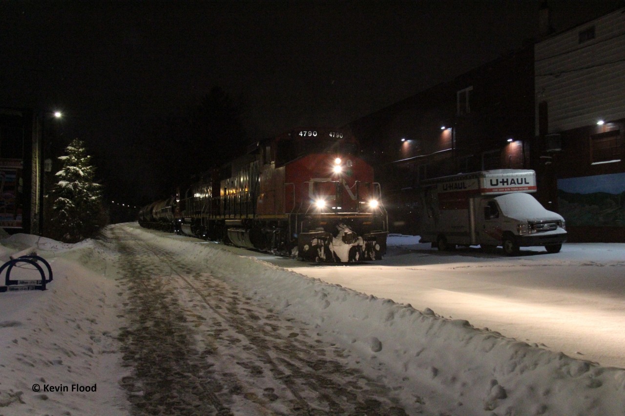 Just after midnight on January 17, 2026, CN 566 continues northbound along the Waterloo Spur about to cross Moore Ave. and Union St. Power was CN 4790-CN 4956.