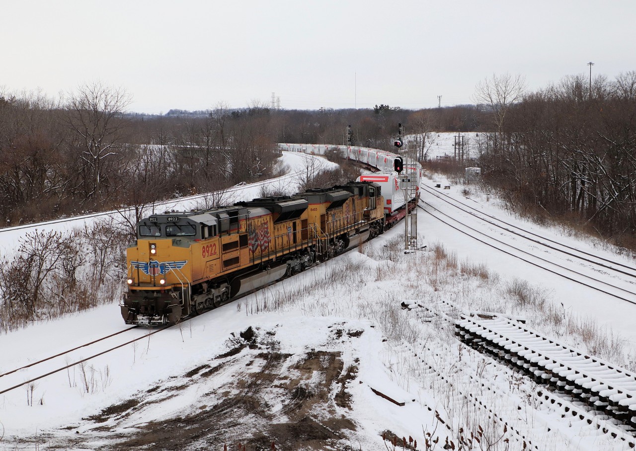 Todays CN 388 proved to be quite different than the usual CN leaders. UP 8922 with UP 8403 slowly make their way down the cowpath with a load of windmill parts where they will stop for a while and wait for the GO trains to clear before heading to the border.