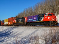 Q 10251 04 rolls through Big Eddy with brand new SD75IACC, on its first cross country trip in the lead. The 8357, sports a special scheme to promote mental health awareness with a message of “You are not alone” and the 988 number for the Suicide and Crisis Lifeline