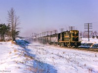 CNR Passenger Extra 3120 East flies beneath Harwood Avenue en route to  Montreal handling extra holiday travelers.

<br><br><i>Scan and editing by Jacob Patterson.</i>