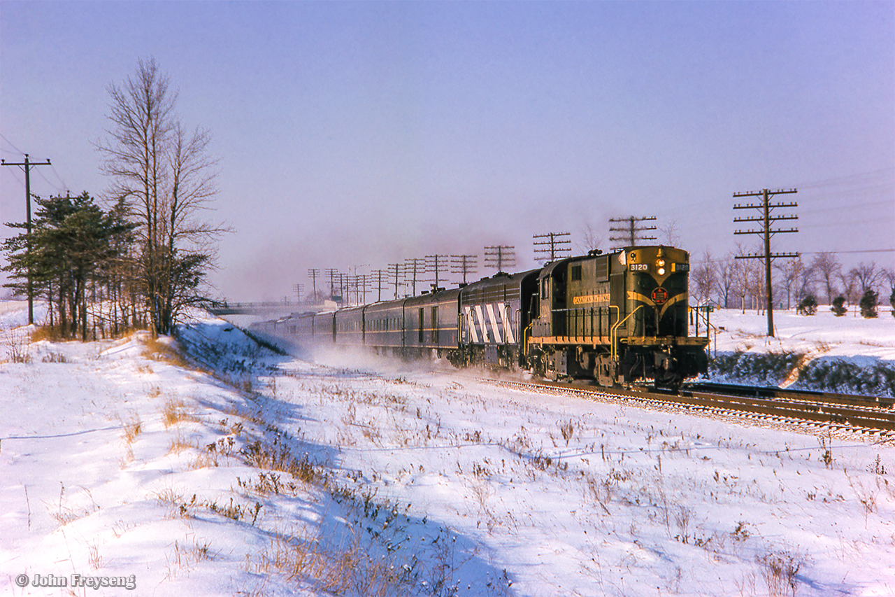 CNR Passenger Extra 3120 East flies beneath Harwood Avenue en route to  Montreal handling extra holiday travelers.

Scan and editing by Jacob Patterson.