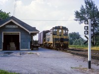Southbound on the Bala Sub, a local freight passes the 1906-built station at Richmond Hill.  <a href=https://www.trha.ca/history/stations/richmond-hill-station/>Closed in 1968,</a> the structure was relocated to the Richmond Hill Soccer Club, where it is <a href=https://hikingthegta.com/wp-content/uploads/2022/03/img_4535.jpg>well preserved.</a>

<br><br><i>Scan and editing by Jacob Patterson.</i>