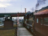 Havelock - Toronto train 381 departs Don station for Union as CN train 409, running Toronto - Capreol, approaches behind CN 4590, CN 4585, CN 4281.

<br><br><i>Scan and editing by Jacob Patterson.</i>