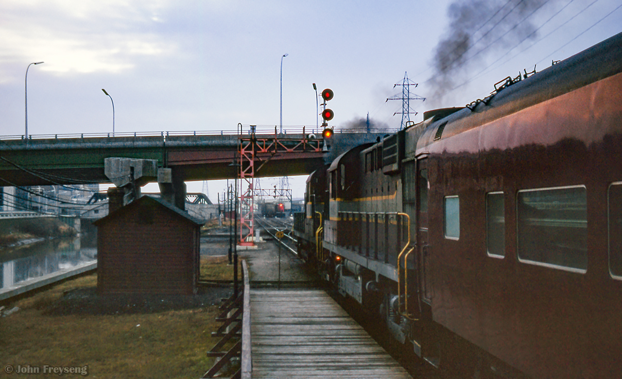 Havelock - Toronto train 381 departs Don station for Union as CN train 409, running Toronto - Capreol, approaches behind CN 4590, CN 4585, CN 4281.

Scan and editing by Jacob Patterson.