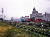 Threading the slip switches out of Union Station, four units lead this passenger train eastbound approaching Jarvis Street.  CPR Budd cars can be seen in the distance, along with TTR Scott Street Tower at left.

<br><br><i>Scan and editing by Jacob Patterson.</i>