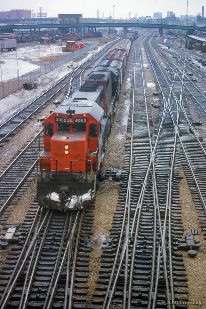 A pair of SD40s lead an eastbound freight through TTR trackage approaching Union Station.

Scan and editing by Jacob Patterson.