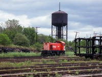 CP MLW S2 7090 sits in the yard at Mactier beneath the water tank.

<br><br><i>Scan and editing by Jacob Patterson.</i>