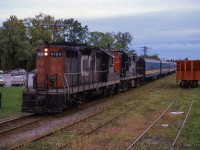 Shot during the 1978 TTC strike, VIA train 632 from Union to Stouffville pauses at Markham's 1871-built station. Originally a Toronto & Nipissing Railway structure, it has served passenger operations for the Midland Railway, GTR, CNR, VIA Rail, and presently GO Transit.

<br><br><a href=http://www.railpictures.ca/?attachment_id=55102>Arriving Markham.</a>

<br><br><i>Scan and editing by Jacob Patterson.