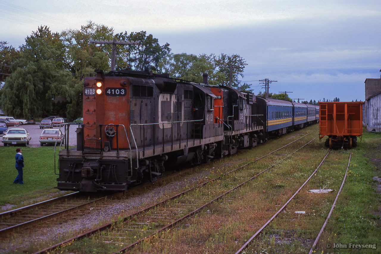 Shot during the 1978 TTC strike, VIA train 632 from Union to Stouffville pauses at Markham's 1871-built station. Originally a Toronto & Nipissing Railway structure, it has served passenger operations for the Midland Railway, GTR, CNR, VIA Rail, and presently GO Transit.

Arriving Markham.

Scan and editing by Jacob Patterson.