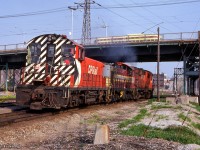 Passing the former site of Don station, CP 8592 hauls a pair of switchers up the Don Branch and on to Agincourt Yard.

<br><br><i>Scan and editing by Jacob Patterson.</i>