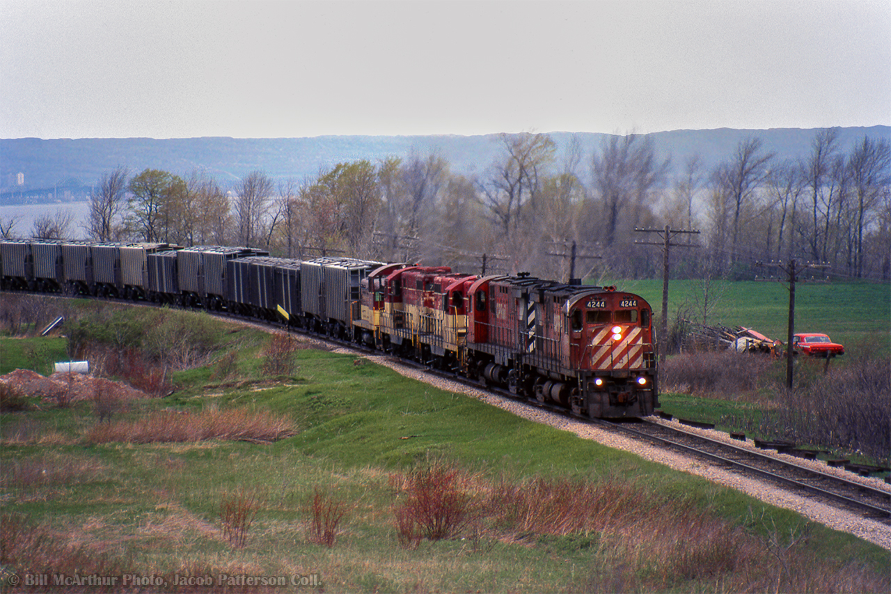 Three TH&B units, assisted by a pair of CP C424s take a phosphate rock extra upgrade at Vinemount.

Bill McArthur Photo, Jacob Patterson Collection Slide.