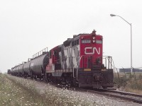 CN 4572, GP-9 is seen handling Procor tank cars just north of Nanticoke, Ontario, in August of 1985. Storage tanks are seen to the right, and the caboose is further back on the main. I was in Nanticoke for a tour of the Stelco plant as a metallurgical engineering student at the University of Texas at El Paso. My mother's cousin, Henning Christiansen of Hamilton, was a Stelco manager and arranged for the tour.